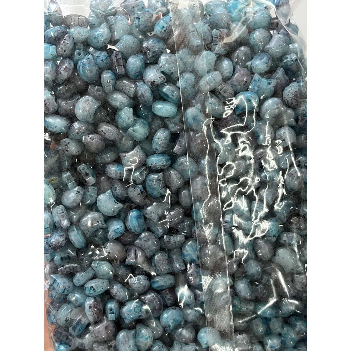 Blue Picasso-style glass cat-head beads in the photographed sales bag – 10 × 8 mm