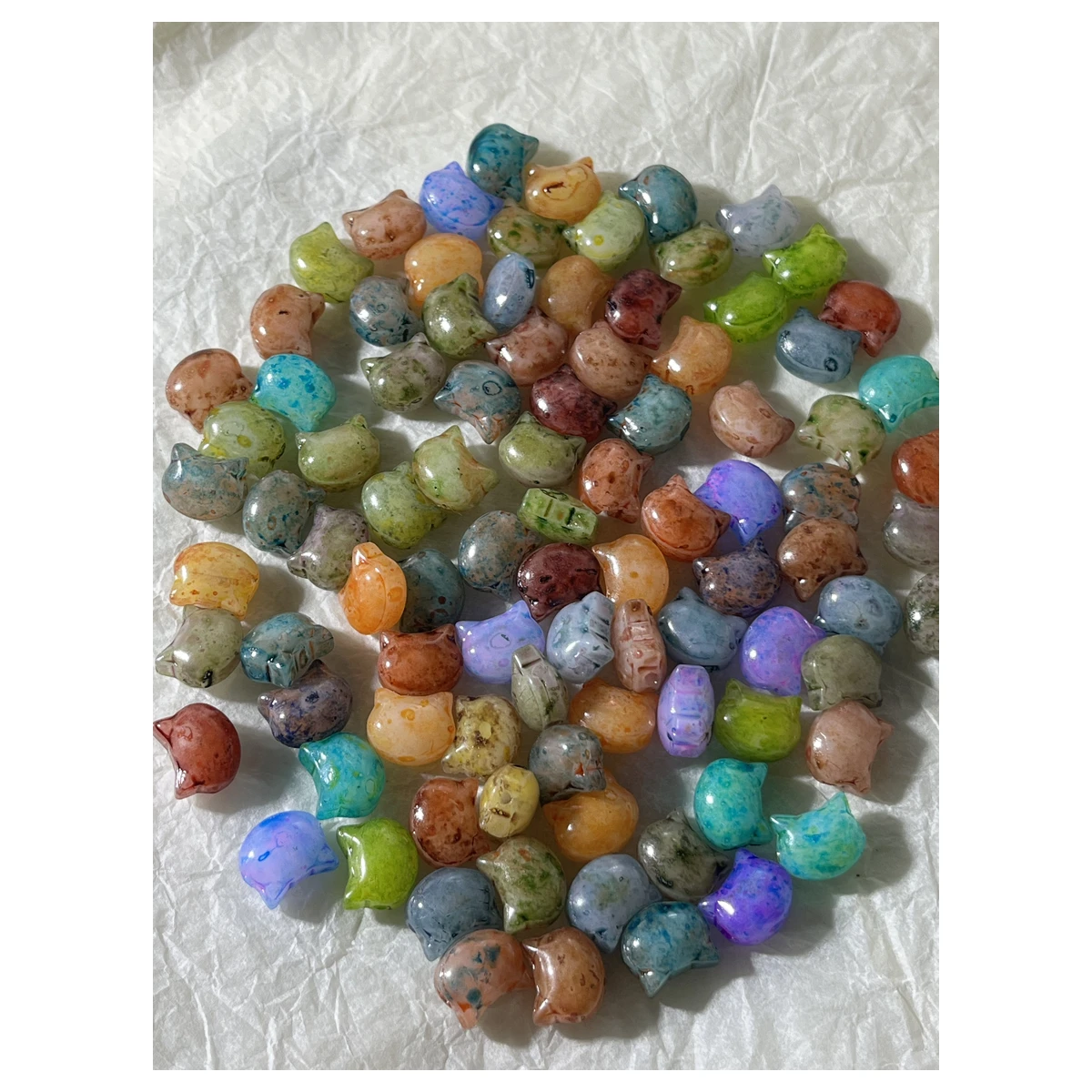 Actual photographed color and shape reference for flattened Picasso-style glass cat-head beads