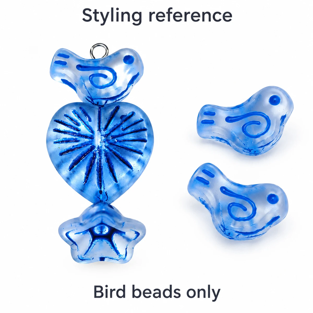 Styling reference with a blue bird bead, heart and flower beads and metal findings